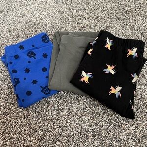 4 pair girls pants. Three leggings one pair of sweatpants